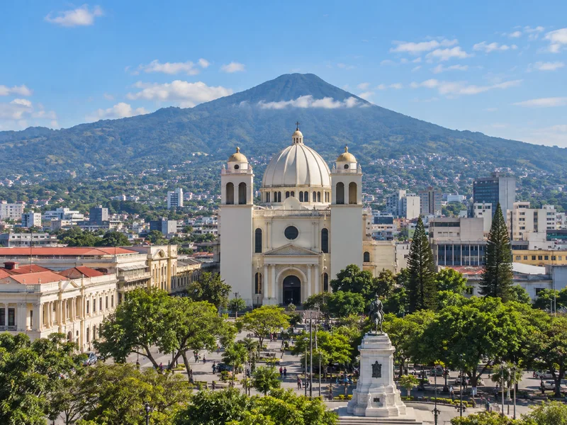 Illustrative San Salvador cityscape; not company premises